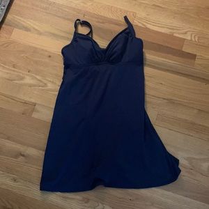 Swim dress. Long torso. Very flattering. Light padding